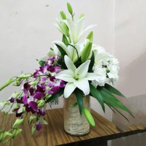 2 Stems Lilies 4 Carnations 4 Orchids In Glass Vase