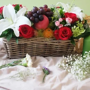 Red Roses And White Lilies In Fruits Basket